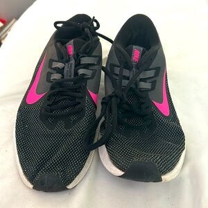 Women’s Nike black and pink running shoes